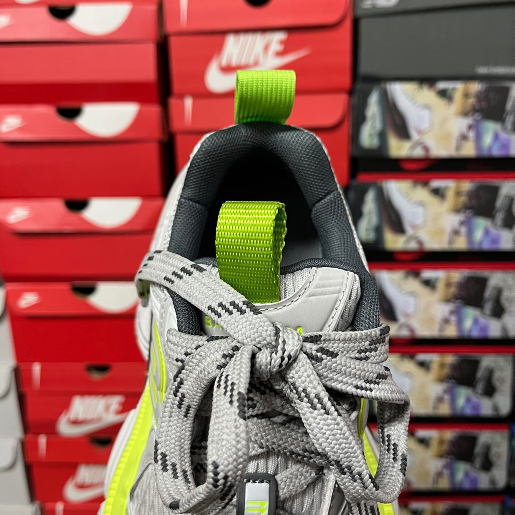 Grey lace-up sneaker with neon green heel strap and woven collar detail
