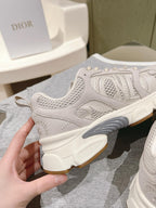 White Dior unisex sneaker heel, textured upper with small embroidered details