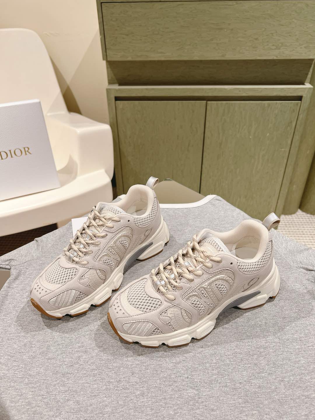 White Dior unisex sneakers with lace-up front, chunky sole and padded tongue