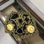 Versace patterned swim shorts with gold Greek key frame and baroque medallion print