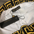 Versace swim shorts with mesh lining and drawstring, showing black Versace label