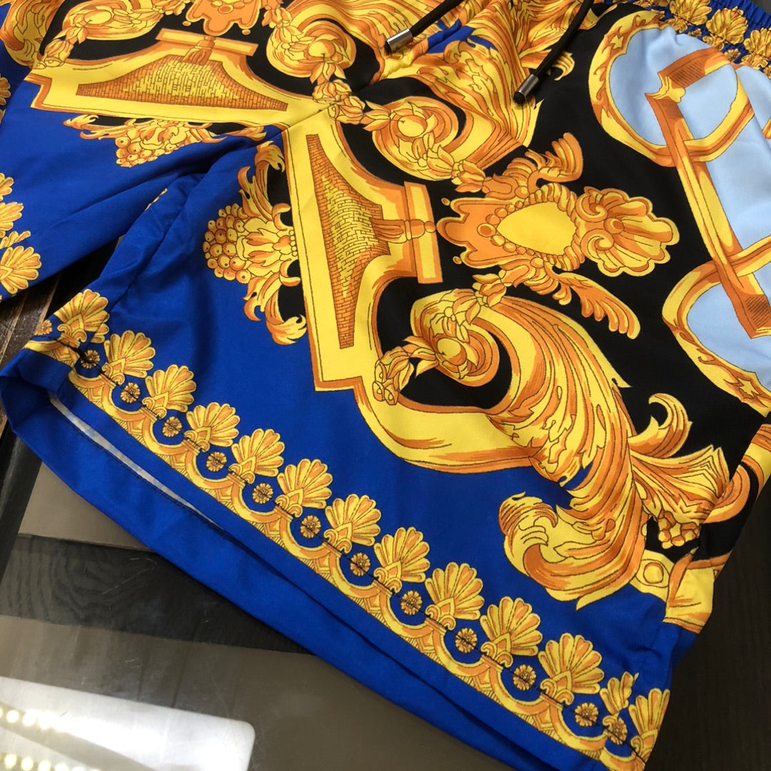 Versace shorts with gold baroque ornament print on blue and black fabric