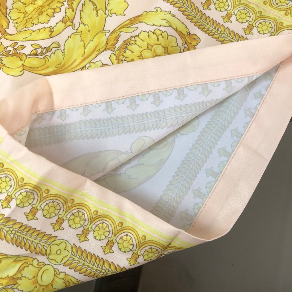 Versace shorts hem with pink facing and pale blue inner panels