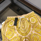 Versace baroque print shorts with white eyelet drawstring and black tag