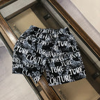 Versace shorts in black with allover white typography logo print.