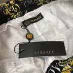 Patterned shorts, white mesh lining with black VERSACE label tag