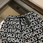 Versace logo shorts with black elastic waistband and allover white SAC... print