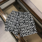 Versace logo shorts front view with black drawstring and white repeating logo text