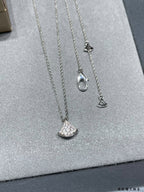 Bvlgari Accessories silver-tone necklace set with crescent pavé pendants on stand