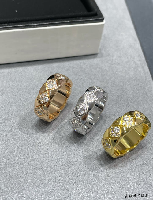 Set of three wide bezel rings with faceted stones in gold and silver tones