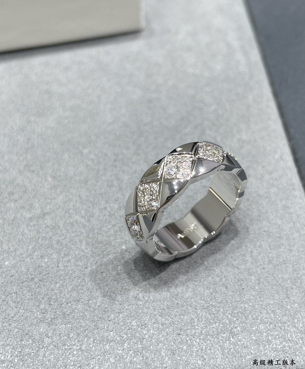 Silver-tone wide ring with faceted stone accents