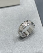 Silver-tone wide ring with faceted stone accents