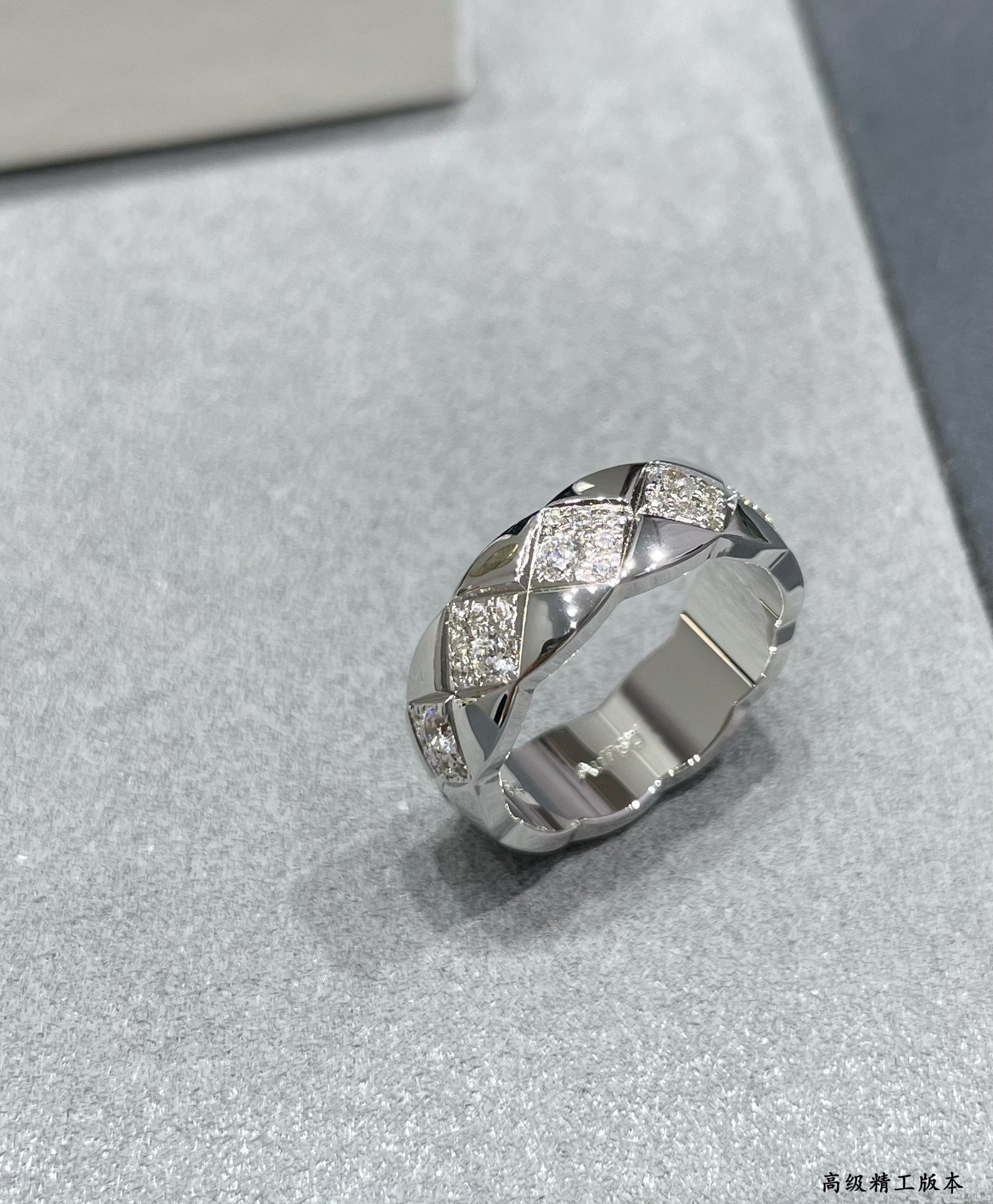 Silver-tone wide ring with faceted stone accents