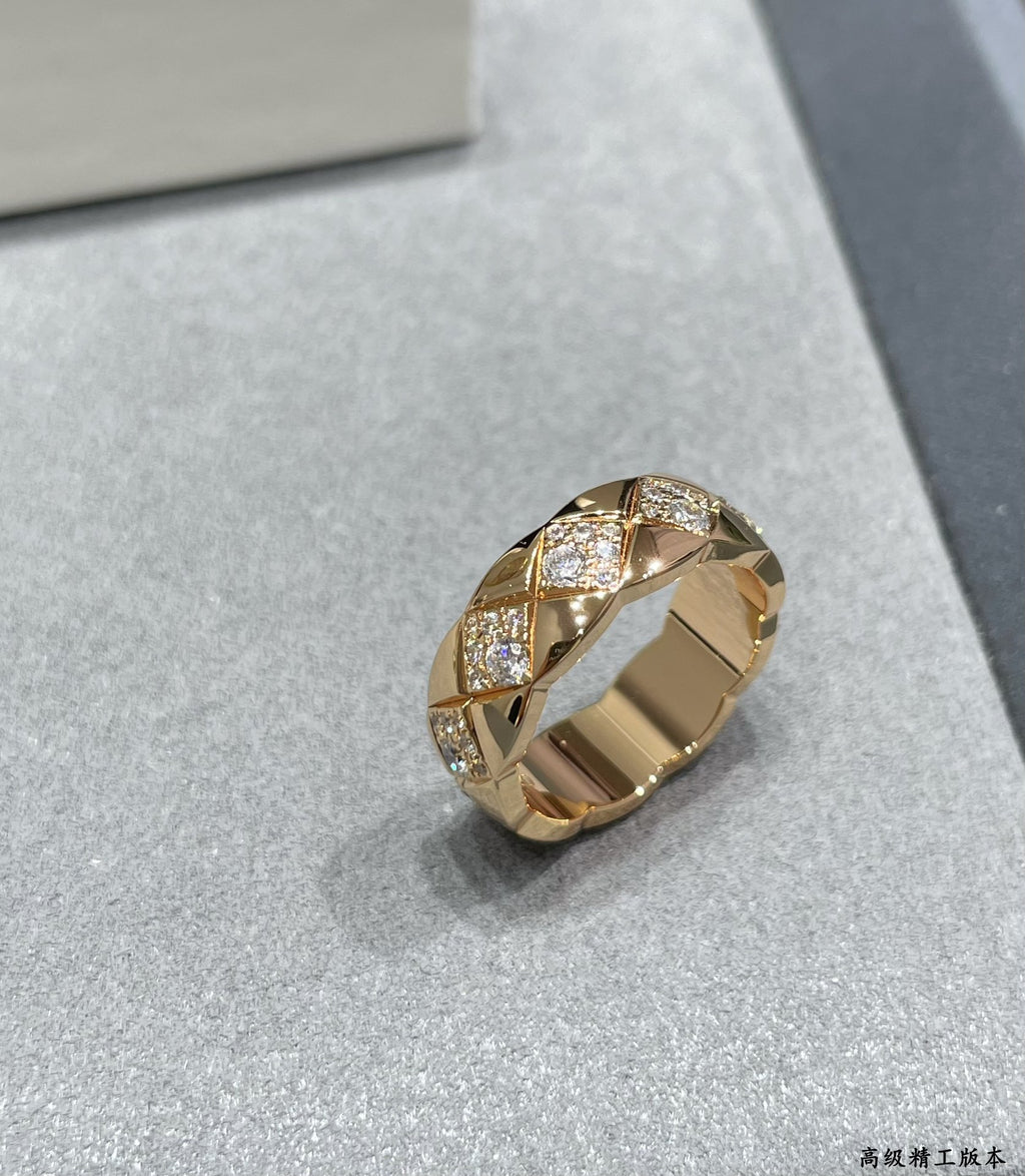 Gold-tone wide ring with faceted stone sections