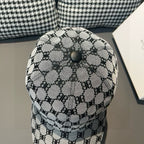 Patterned baseball cap with domed crown, top button, and monogram repeat print