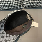 Inside view of monogram baseball cap with black interior lining and strap