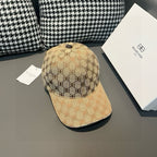Tan monogram baseball cap with curved visor and stitched side panels.