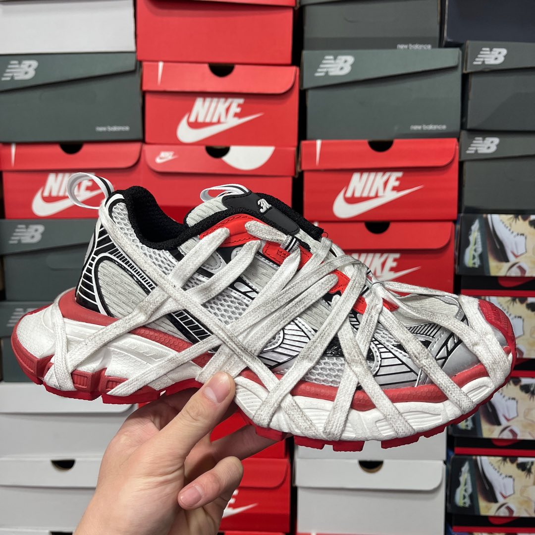 White, red and black unisex sneakers with lace-up front and mesh texture