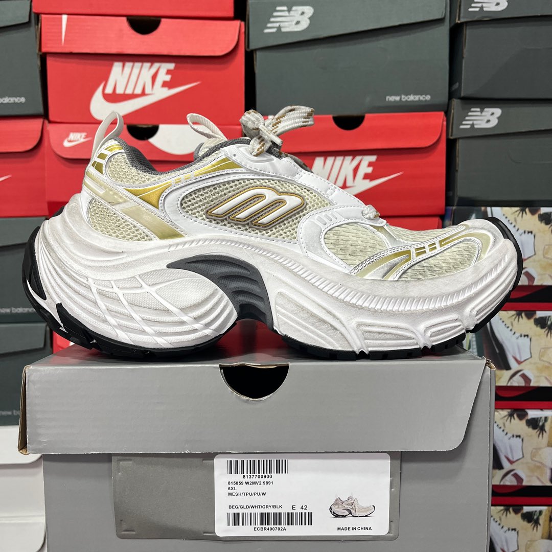 White and light-yellow lace-up sneaker with gold side logo and textured panels