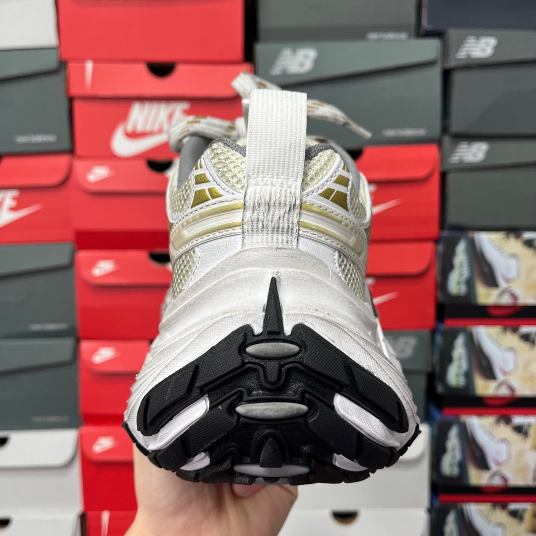 Sneaker heel showing black-and-white tread pattern on the outsole