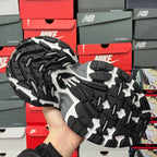 Sneaker outsole with chunky black tread and white flex grooves