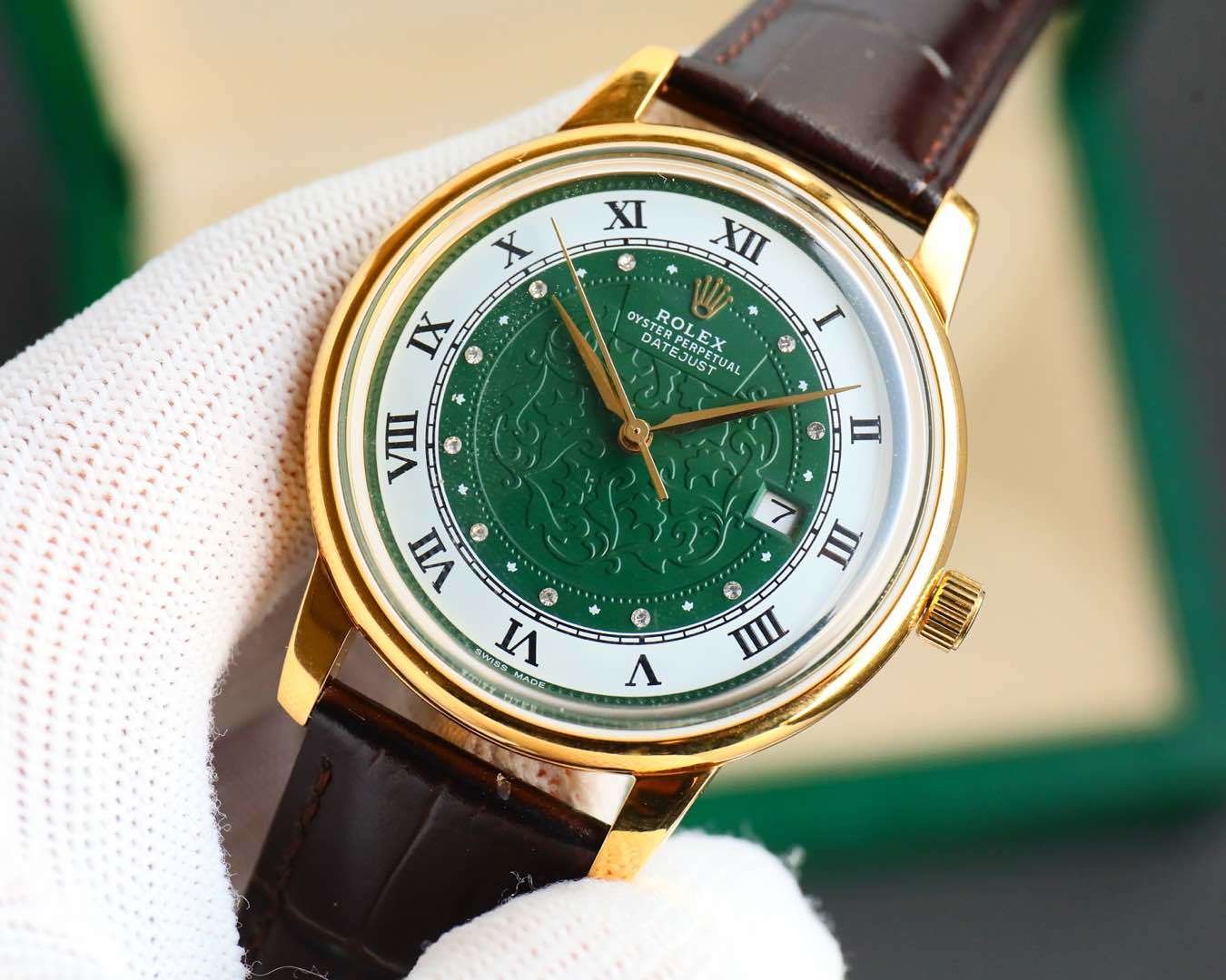 Rolex watch with green dial, gold-tone case, brown leather strap, date window at 7