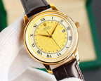 Rolex watch with yellow dial, gold-tone case, brown leather strap, Roman numerals