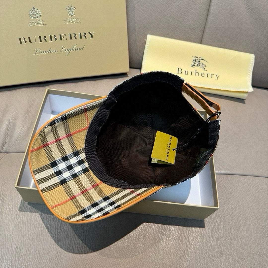 Plaid cap with black interior lining and tan trim edge; adjustable back strap.