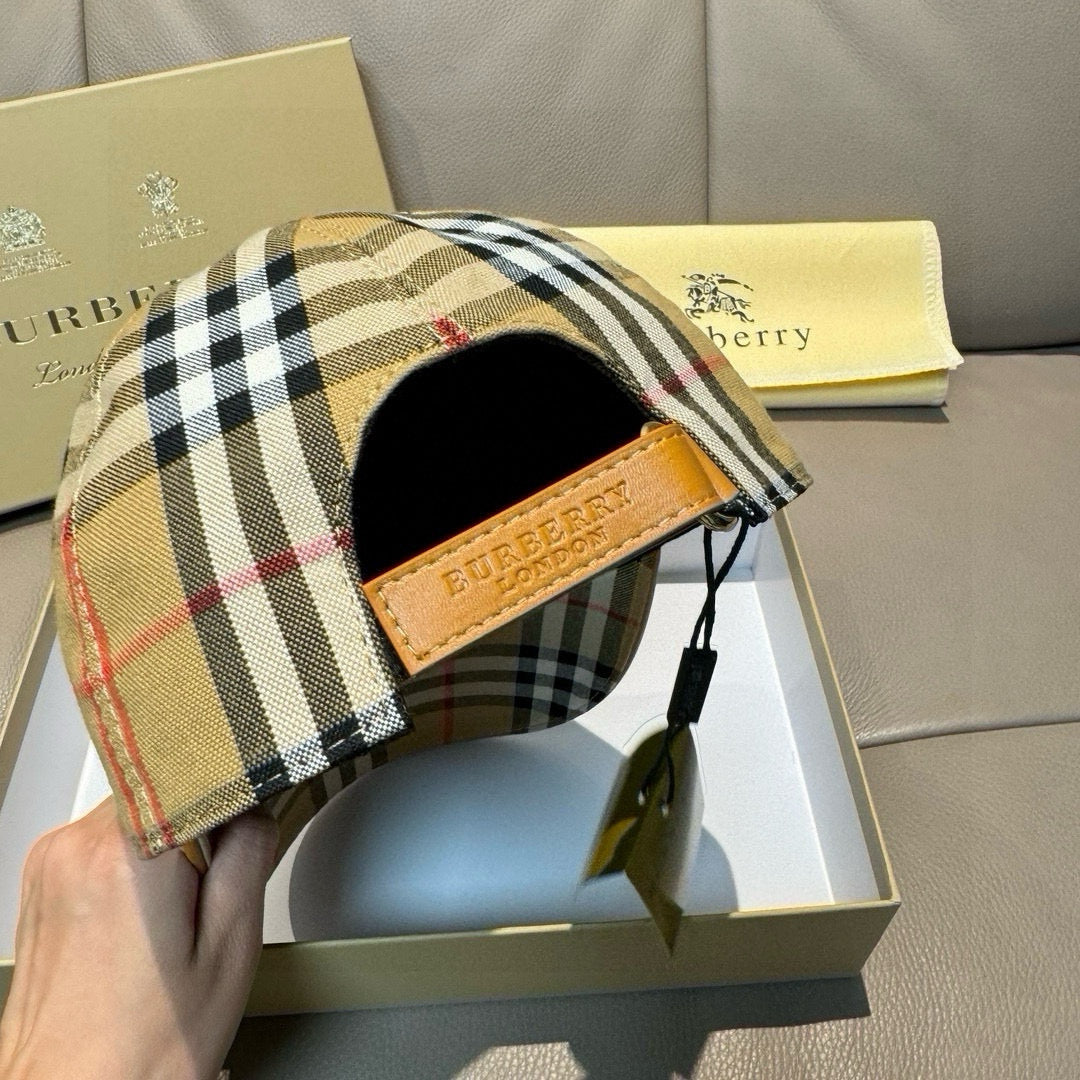 Plaid cap interior view with tan leather patch and black drawstring strap.