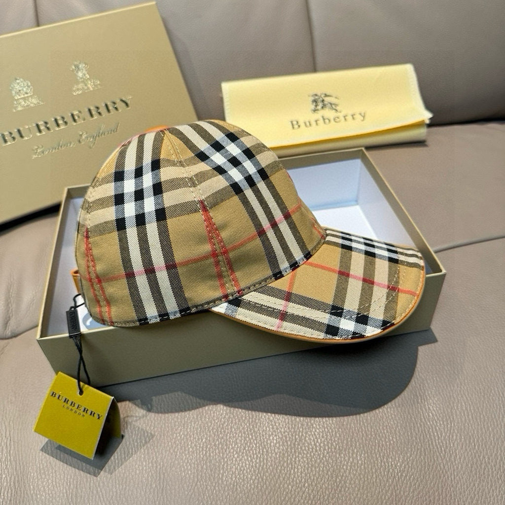 Plaid cap with curved brim, multicolor stripe band, and adjustable black back strap.