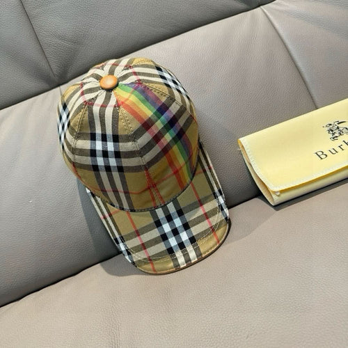 Plaid cap in beige with multicolor stripes, curved brim, and button crown detail.