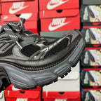 Black and gray Balenciaga sneaker side profile with lace-up closure and chunky sole