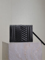 YSL small black quilted leather crossbody bag with top flap and strap.