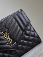 Black quilted YSL flap bag detail with gold-tone YSL logo and strap
