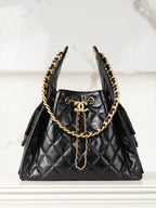 Chanel quilted black leather mini bag with gold chain handles and tassel detail