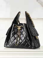 Chanel black quilted leather tote bag with gold chain strap and CC clasp