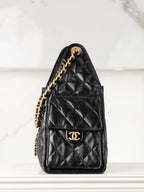 Chanel black quilted leather mini bag with gold chain shoulder strap and CC logo