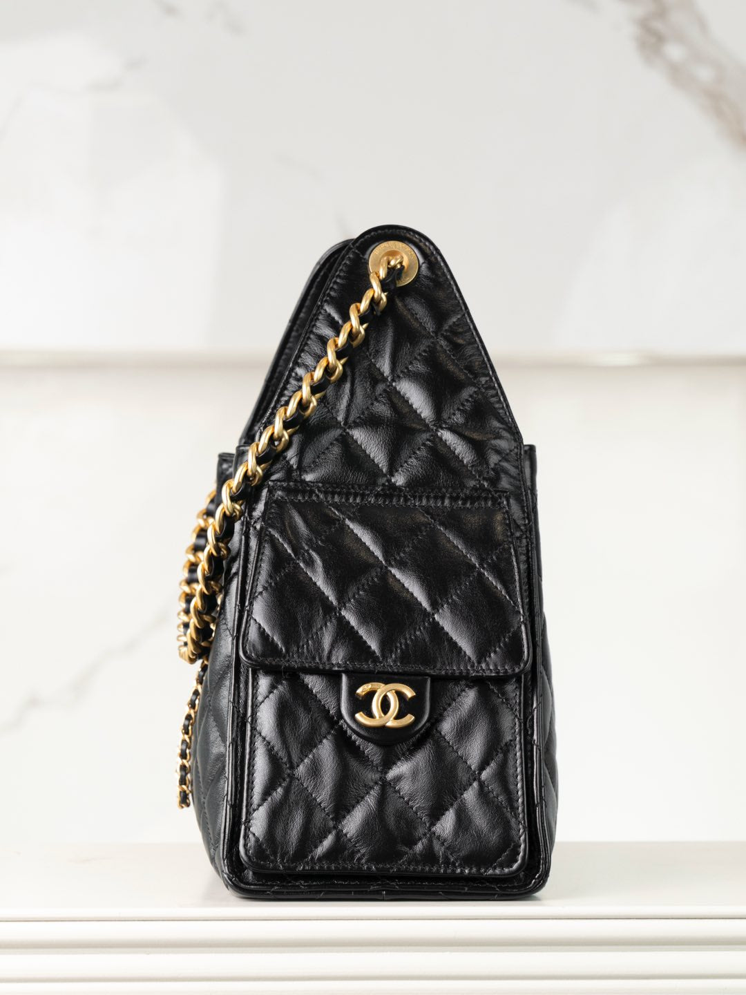 Chanel black quilted leather mini bag with gold chain shoulder strap and CC logo