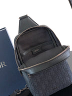 Dior mini crossbody bag front view with monogram panel, top zip, and adjustable strap
