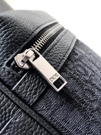 Dior mini crossbody bag zipper and logo plaque close-up on textured leather