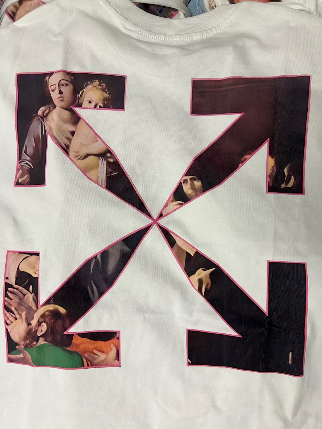 Graphic T-shirt with large X-shaped collage and portrait panels on the front
