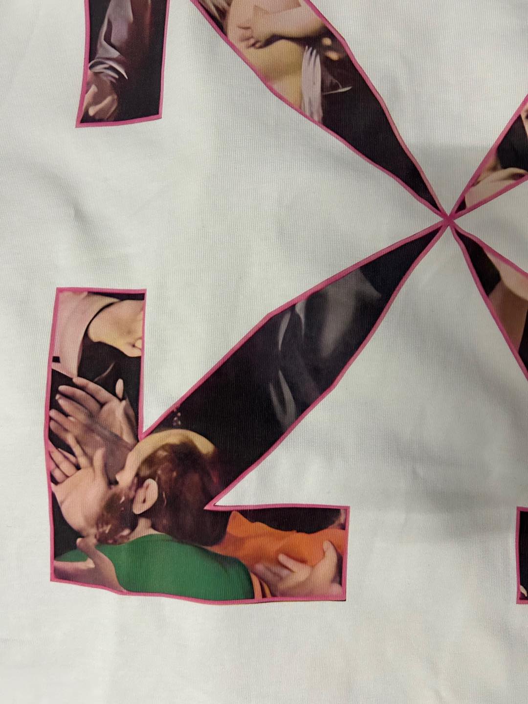 Graphic T-shirt with pink-bordered collage scenes arranged in an X pattern