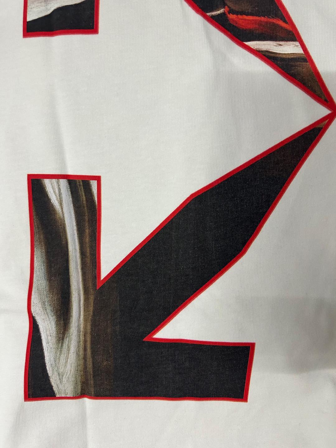 Off-White graphic T-shirt, close-up of red outlined black logo