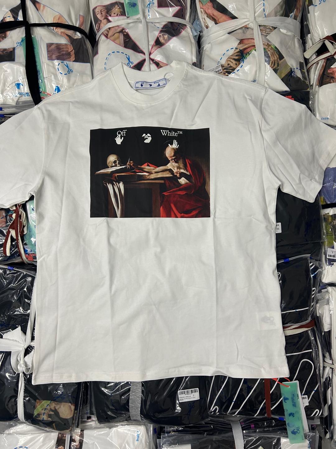 Off-White off-white graphic T-shirt, front black artwork with red accents