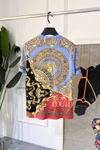 Crewneck T-shirt in light blue with circular baroque Medusa print and Greek key border