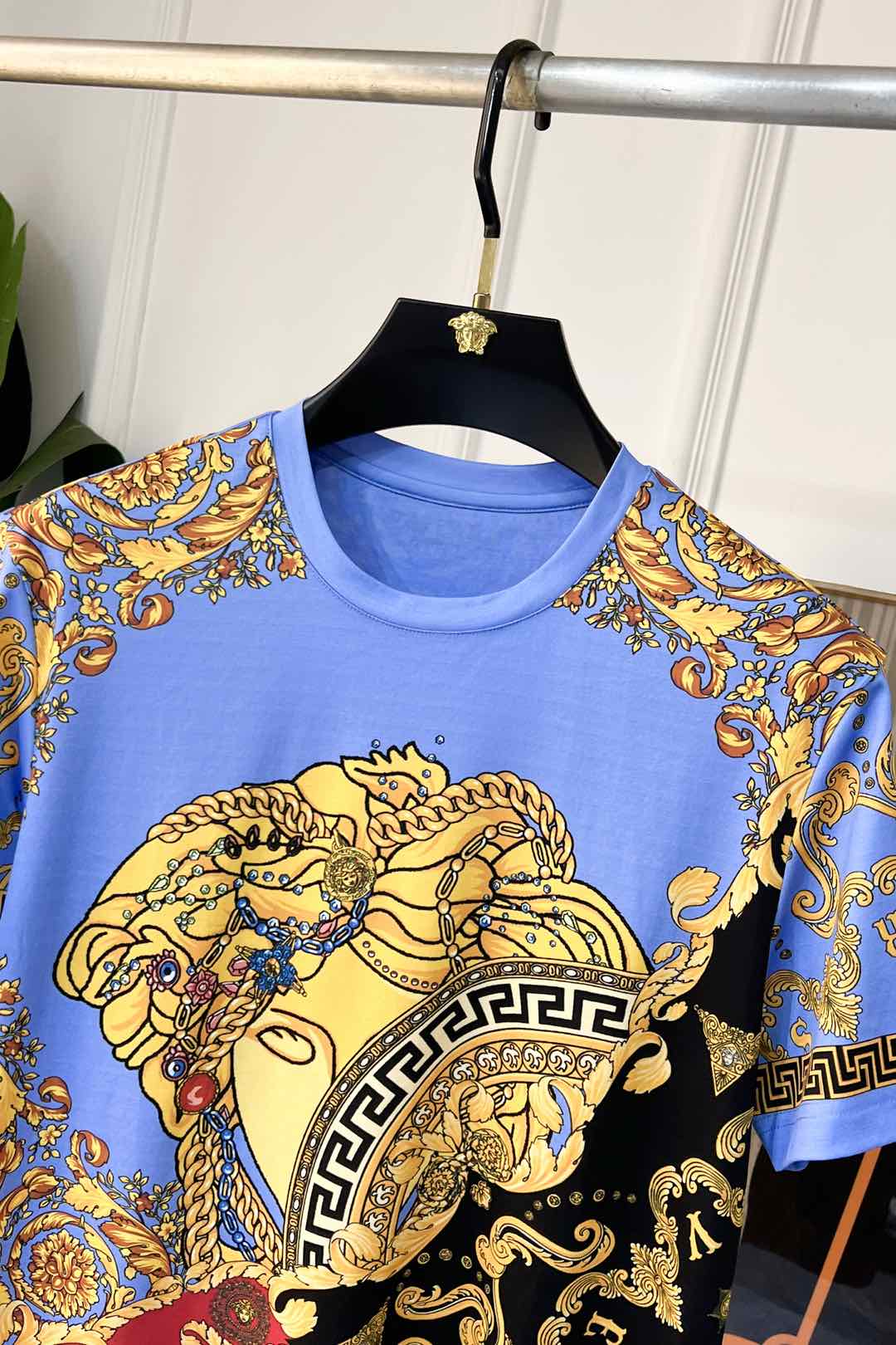 Light blue crewneck T-shirt with Medusa head and gold baroque detailing
