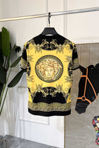 Short-sleeve graphic T-shirt in black with large yellow Medusa-style motif