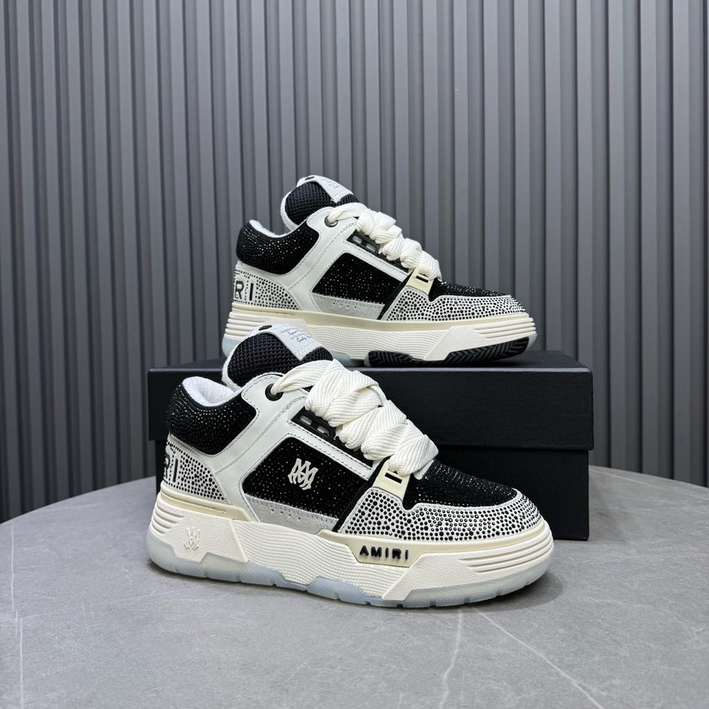 Pair of black and white lace-up sneakers with chunky sole