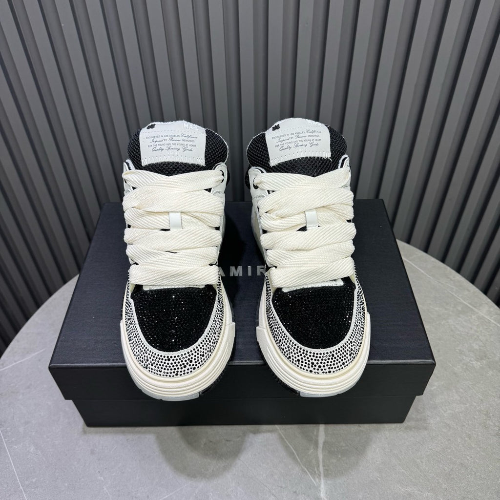 Back view of black and white sneakers on box, showing heel and ankle
