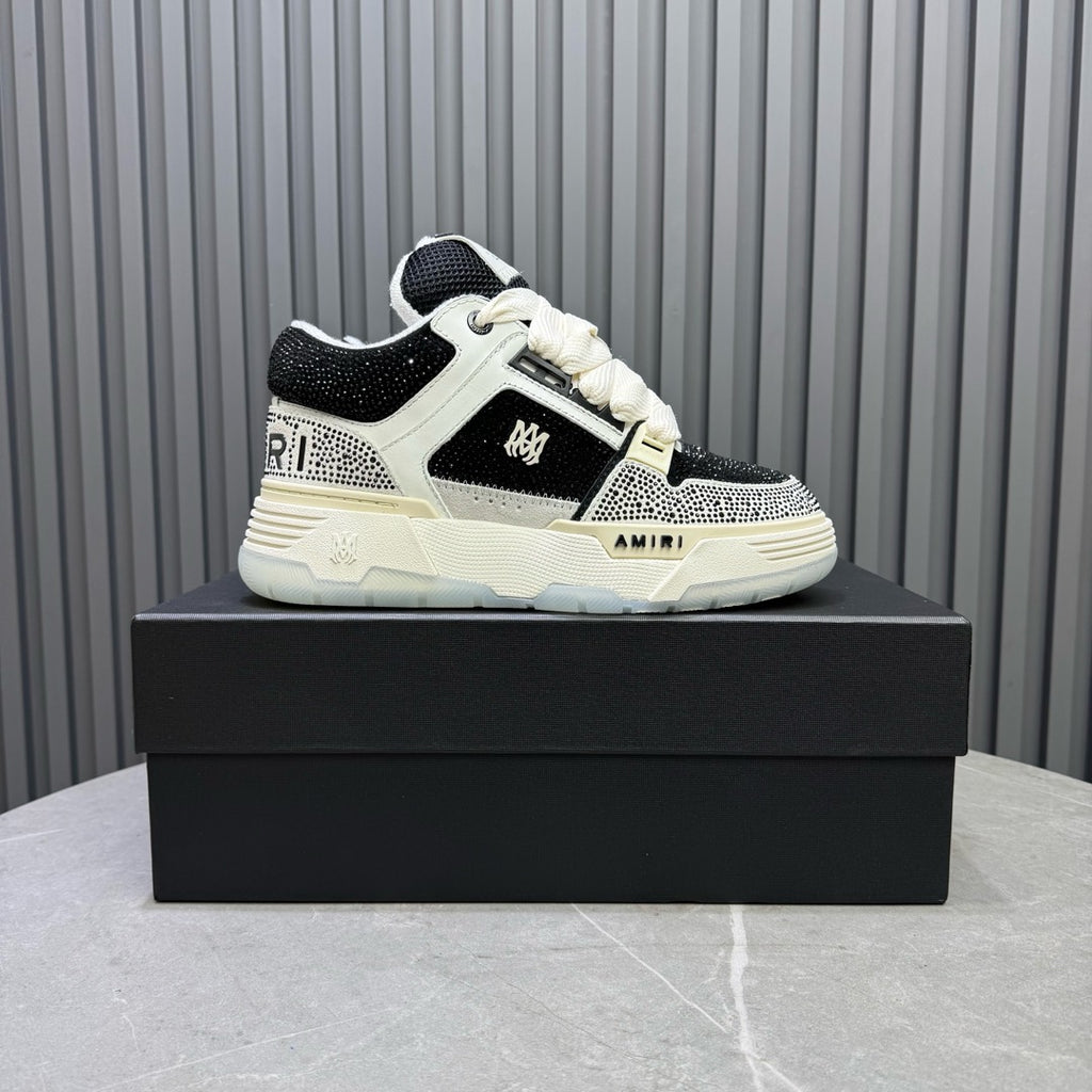 White and black sneakers with lace-up front and textured side panels